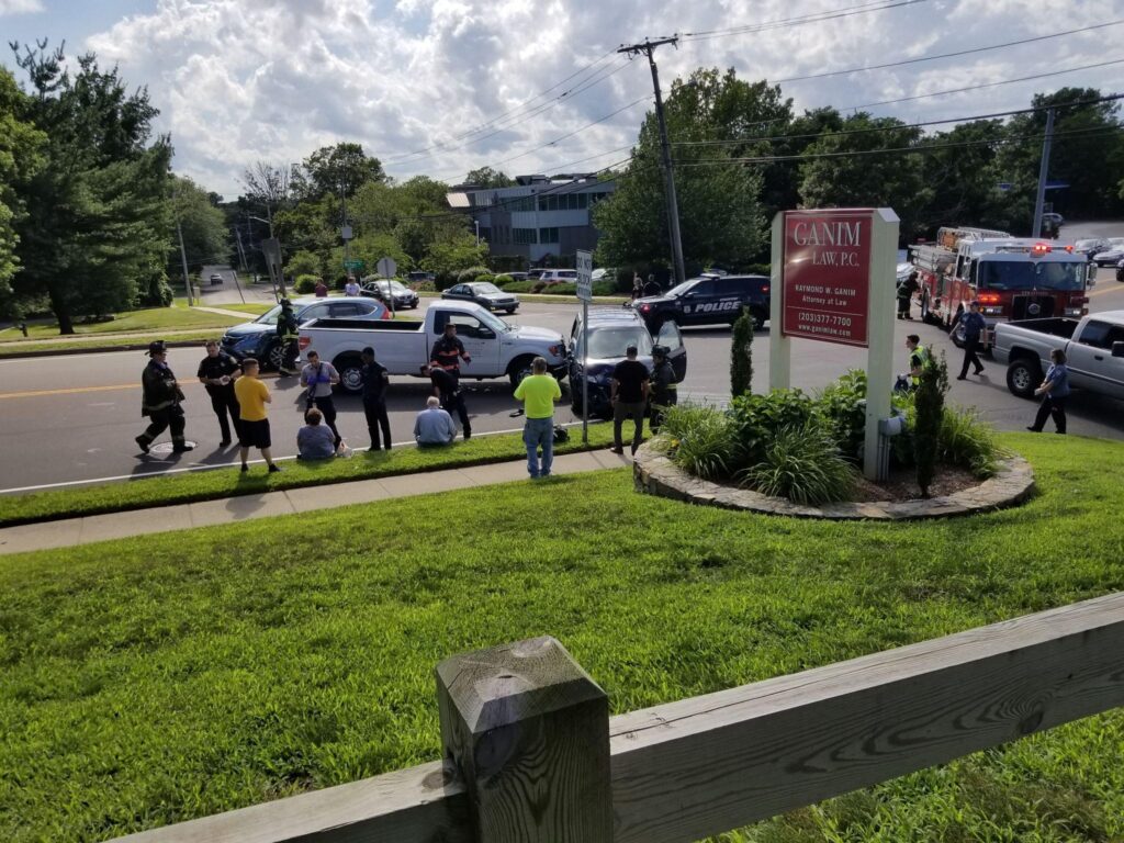 Car accident scene with police and vehicles in front of Attorney Raymond W. Ganim - Personal Injury Law and Legal firm in Stratford, CT